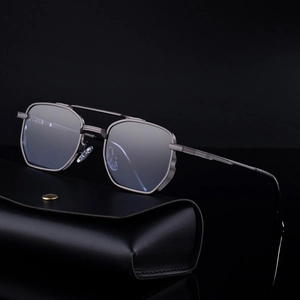 Men's square metal sunglasses with dark grey frame and blue lenses on leather case