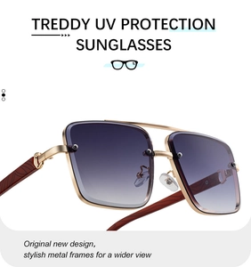 Detail of square gold metal sunglasses with wood grain temples and gradient blue lenses