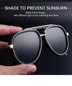 Detailed view of silver metal pilot sunglasses frame with double bridge design