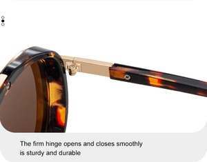 Detailed close-up of sturdy gold metal hinges on tortoise shell aviator sunglasses