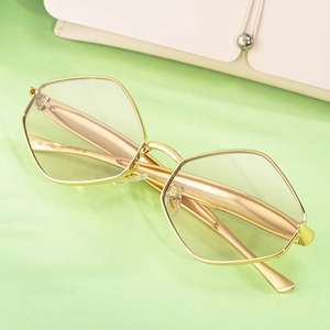 Lunettes de soleil hexagonales dorées modernes pour femmes avec verres transparents tendance