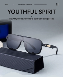 Detail view of polarized square sunglasses with one-piece lens and gold metal accents