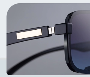 Macro shot of square sunglasses frame with gold metal inlay and silver hinge detail