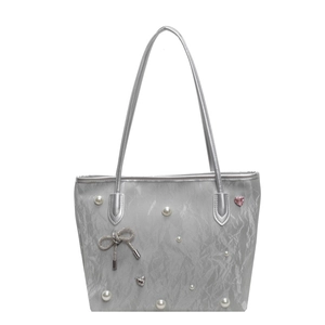 Silver metallic pleated tote bag with pearl accents and a crystal bow charm pendant