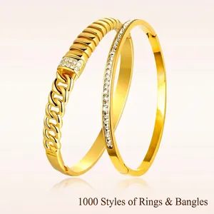 Elegant gold clover stainless steel bangle with cubic zirconia and cuban chain texture
