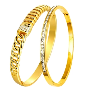 Golden stainless steel bangle set featuring starburst crystal inlay and Cuban chain design