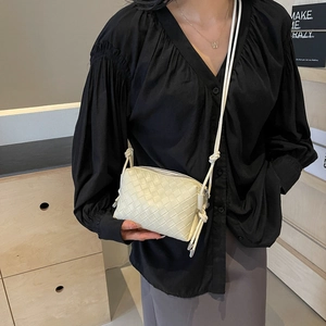 Minimalist cream woven leather crossbody bag with square pattern and slim strap