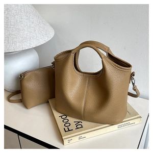 Detail of brown lychee grain leather tote bag set with matching inner zipper pouch
