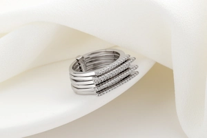 Detailed view of S925 sterling silver stamp on minimalist multi-layer zircon ring