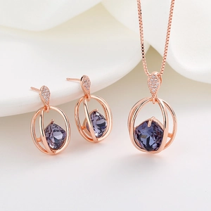 Rose gold jewelry set with purple square crystal necklace and matching stud earrings