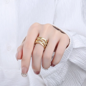 Crossed X-shape gold plated ring for women with pave set cubic zirconia stones