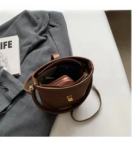 Detail view of brown bucket bag interior showing spacious compartments for daily essentials