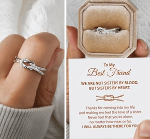 Knot ring with sparkling white zircon in octagonal velvet box and friendship card