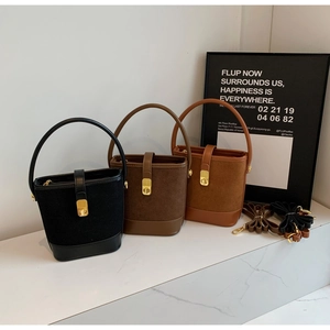 Three bucket bags in black, coffee, and tan with suede and leather textures