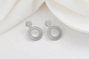 Detailed view of silver zircon geometric earrings featuring micro-set round dangles