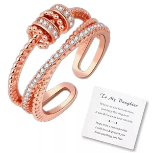Detail of a spinning fidget ring in rose gold with a To My Daughter gift card