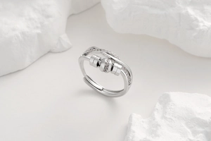 Detail of adjustable silver ring with movable beads and micro-set cubic zirconia accents