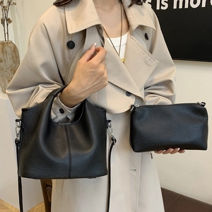 Chic black litchi pattern leather bucket bag set with wide shoulder strap for women