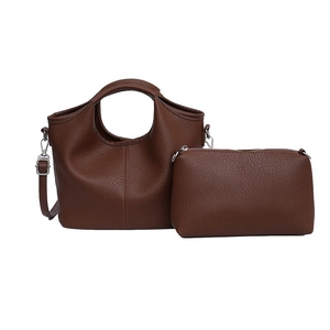 Dark brown pebble leather tote bag set with unique hollow handle and silver metal hardware