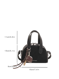 Detail view of mini black Boston bag with suede panel, dimensions and brand logo