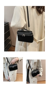 Detailed close-up showing the dual-material texture and silver zipper of this black box bag