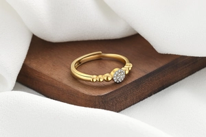 Macro detail of golden bubble ring with zircon clusters and micro-bead metal band