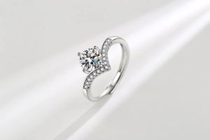 Macro shot of V-shaped crown moissanite ring with silver plating and adjustable opening