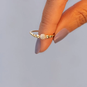 Elegance S925 silver ring featuring a sparkling paved diamond ball and gold bead details