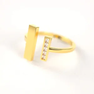 Minimalist double-T open ring in 18K gold finish with square-cut crystal stones