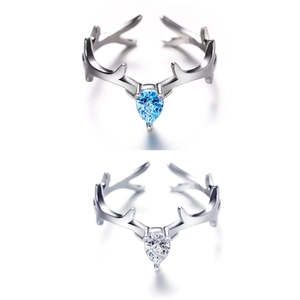 Elegant adjustable deer antler rings with pear-cut light blue and clear stones