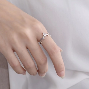 Elegant silver elk antler open ring with a teardrop gemstone on female hand