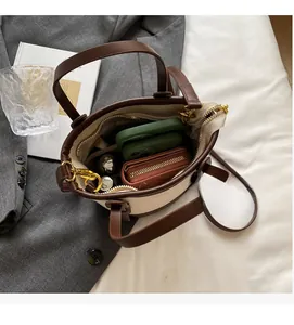Top view of canvas bucket bag showing large interior capacity for phone and wallet