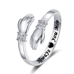 Detailed view of hug hands ring with crystal accents and Always Love You Mom engraving