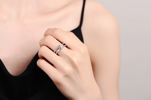 Macro detail of a double-layered silver ring featuring zircon geometric link and pavé stones