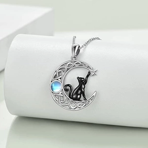 Celestial crescent moon necklace with black cat silhouette and blue moonstone pendant