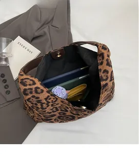 Interior view of large leopard print tote bag showing spacious storage for daily essentials
