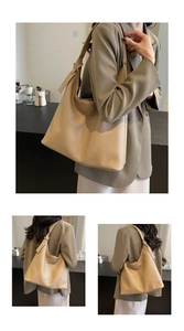 Detail of lychee pattern leather shoulder bag with adjustable strap in khaki