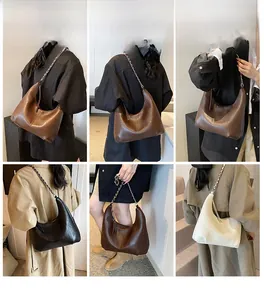 Detail shots showing high-quality lychee grain leather and metal chain strap of hobo bag