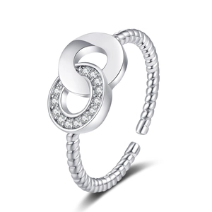 Detail of twisted cable ring with interlocking pavé zircon double loop design