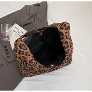 Detail view of large leopard print tote bag with magnetic clasp and spacious interior