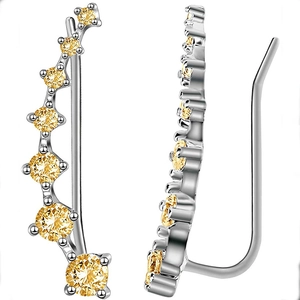 Detail of curved silver ear climbers featuring seven gradient yellow cubic zirconia stones