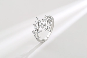 Macro detail of leaf-shaped zircon vine ring with S925 sterling silver hallmark