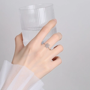 Minimalist silver geometric open ring with parallel rows of zircons on a model's hand