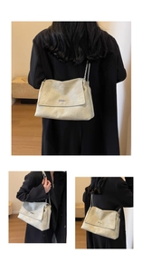 Detailed views of the textured chain shoulder bag shown with various wearing angles