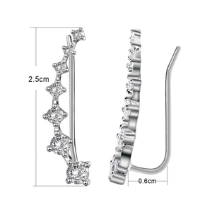 Silver constellation ear climbers with seven graduated cubic zirconia stones on white background