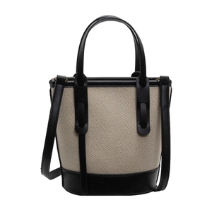 Contrast bucket bag in off-white canvas and black leather with adjustable shoulder strap