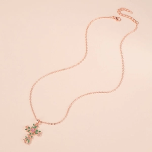 Rose gold leaf necklace with cross pendant featuring pink stone and green gems
