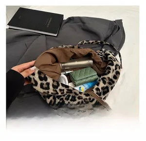 Detail showing the large interior capacity of this leopard print plush tote bag
