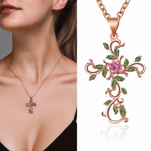 Rose gold leaf cross necklace with pink zircon stone and green vine leaves