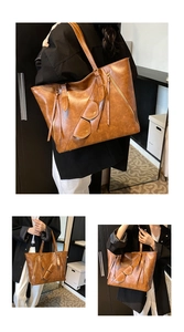 Detailed views of a large vintage brown tote bag with decorative zippers and small pouch